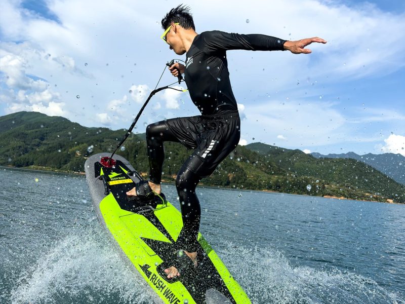 a person riding a surf board on a body of water