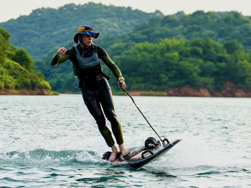 a person riding a surf board on a body of water