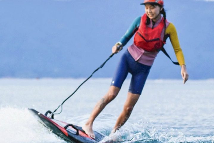 a man water skiing behind a boat
